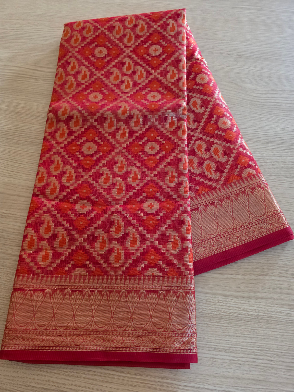 Red with gold zari weave